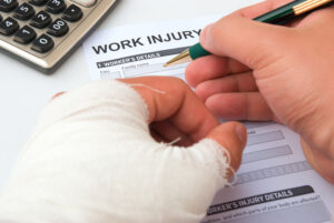 Injured worker fills out Workman's compensation form at Rush and Nicholson